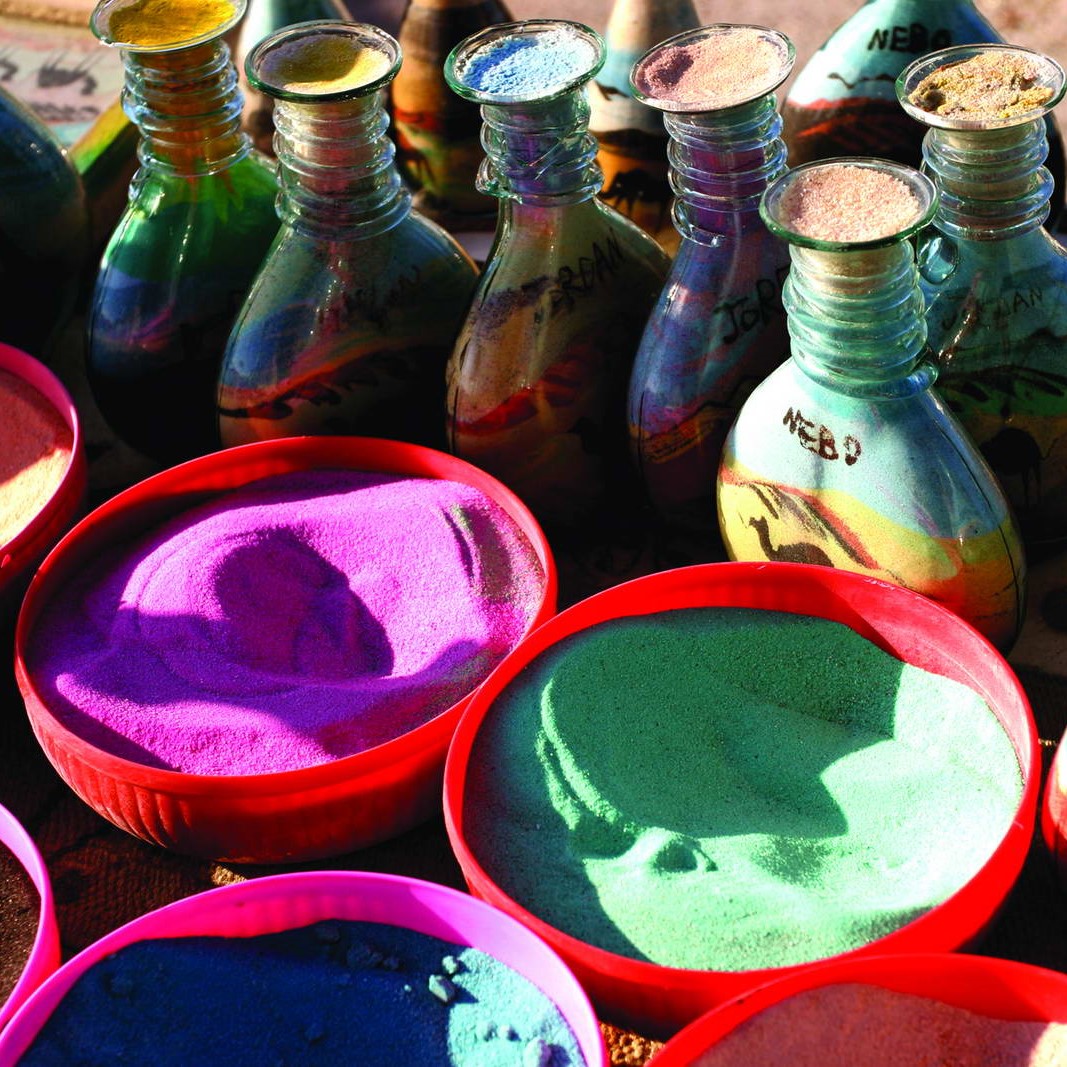 Tourists exploring Jordanian souvenirs during Jordan Tour